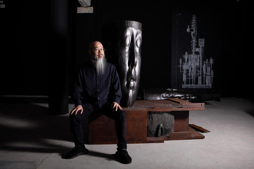 Wallace Chan with pieces of Titans XIV, his titanium sculpture deconstructed (Credit: Massimo Pistore. )