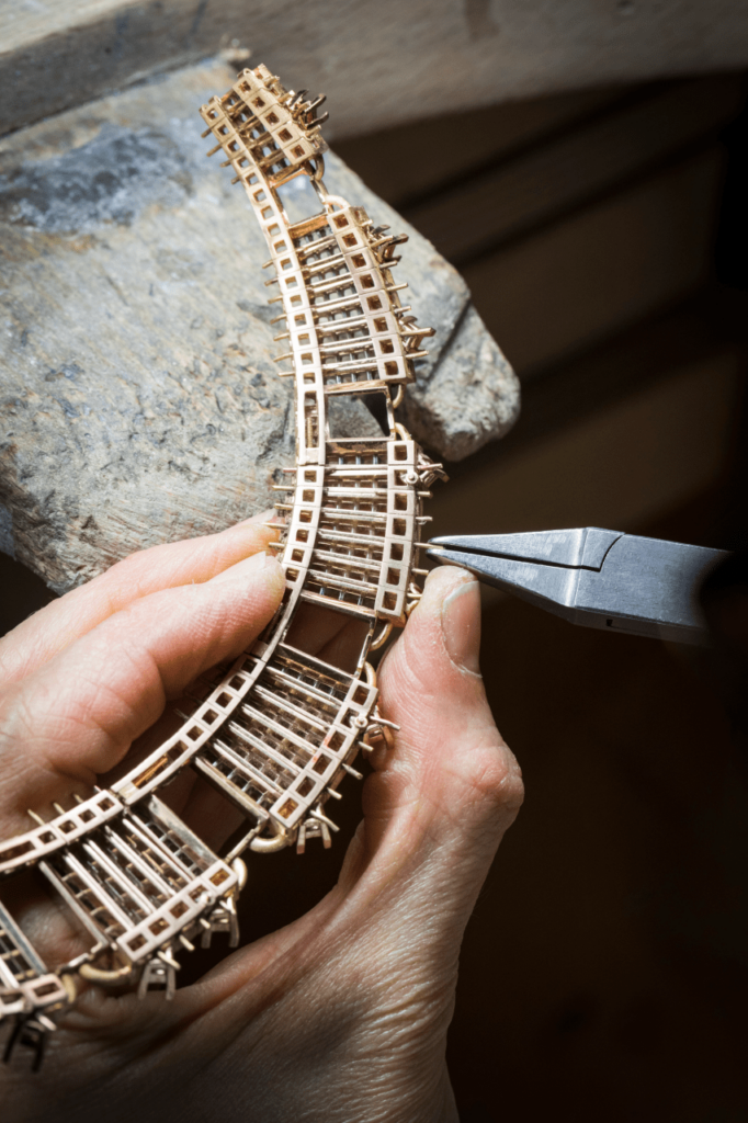 The Mystery setting technique involves fitting meticulously cut stones, one by one, into gold rails