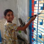 Kids add the finishing touches to the Anganwadi