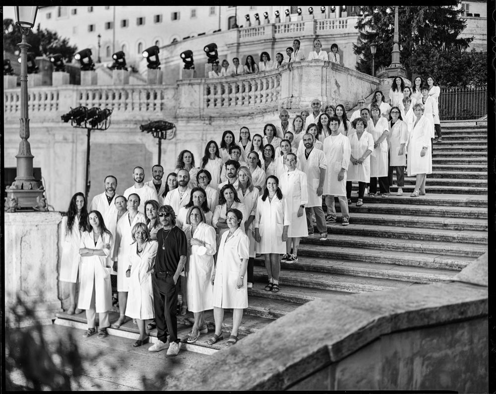 Pierpaolo Piccioli and the Valentino atelier team on the Spanish Steps in Rome in occasion of the autumn/winter 2022 haute couture runway show (Credit: Valentino)
