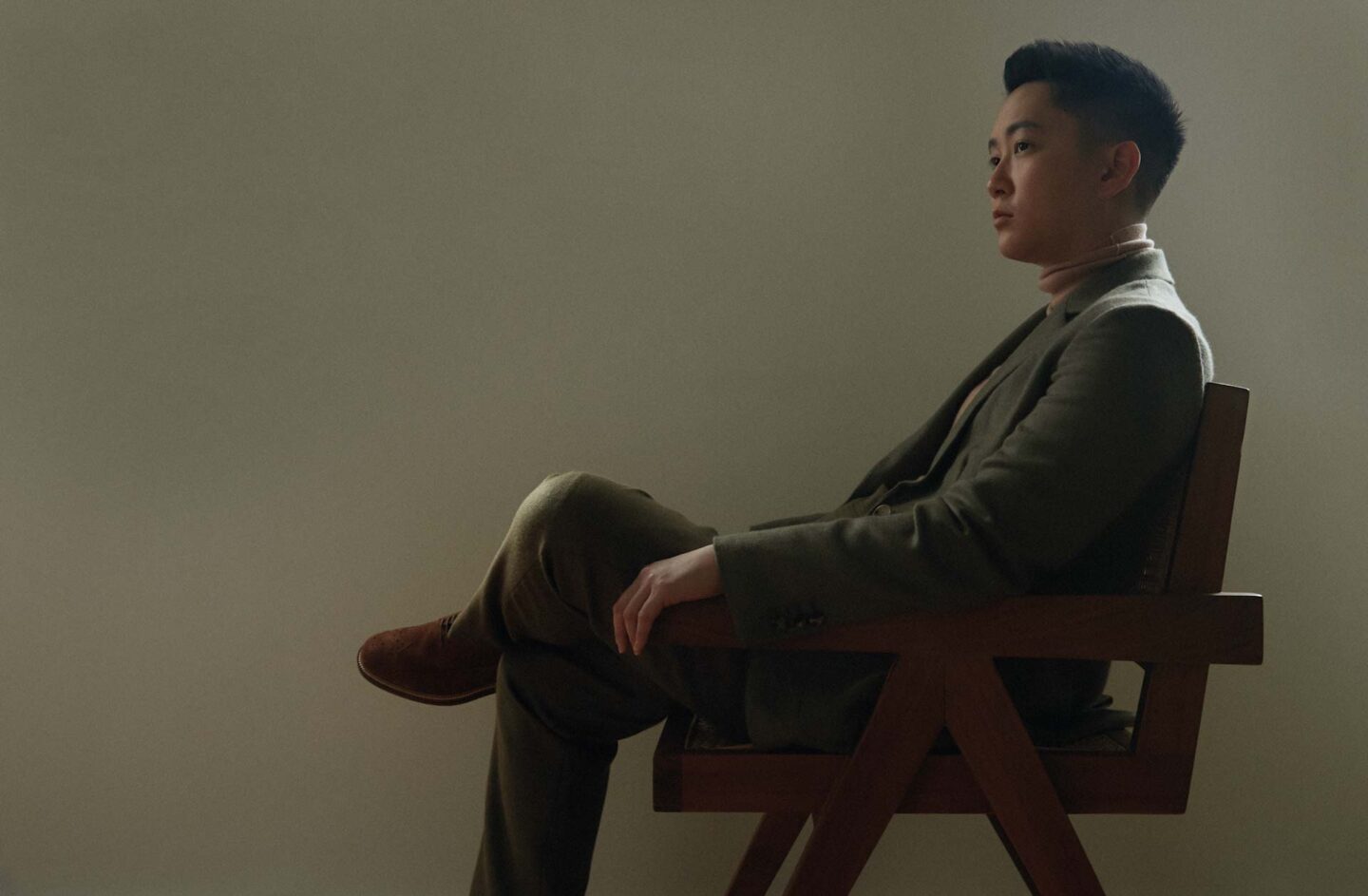 GJ Wee sitting on a chair