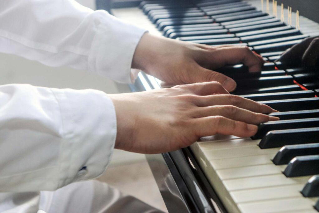 Nicholas Ho playing the piano