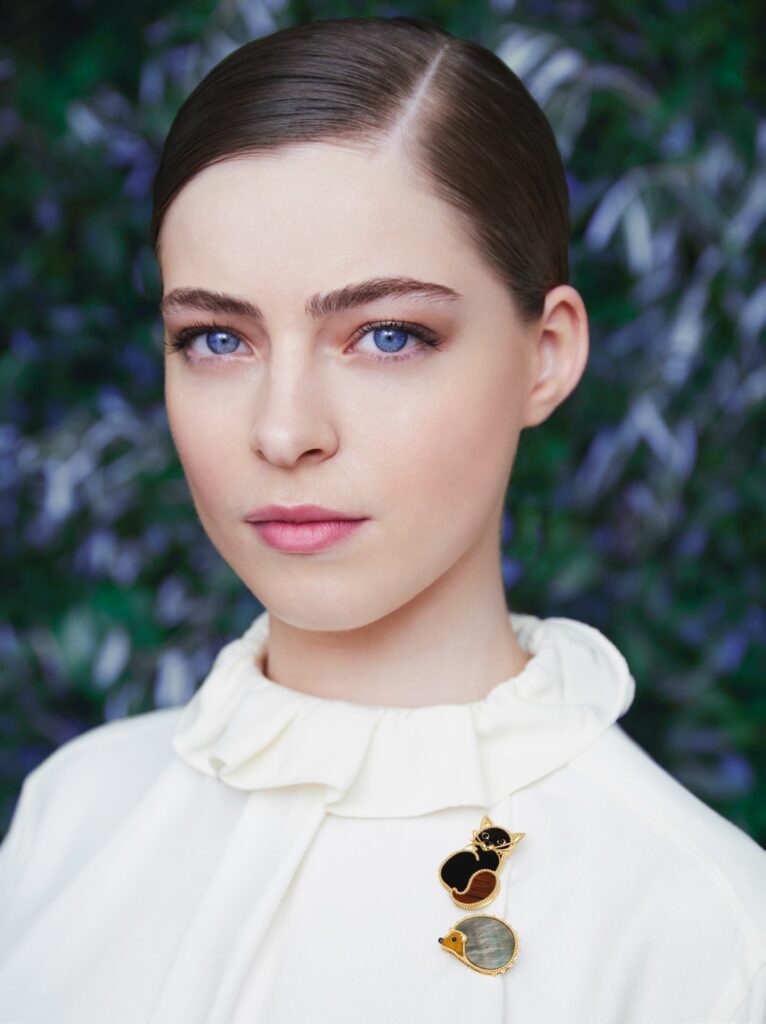 Model wearing the Cat clip in yellow gold, mahogany, obsidian and onyx, and Hedgehog clip in yellow gold, grey mother-of-pearl, tiger’s eye and onyx (Credit: Van Cleef & Arpels)