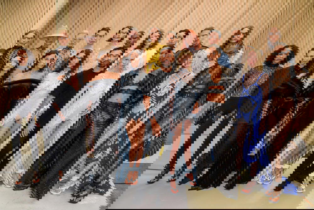 Riccardo Tisci with models at his final runway show for Burberry