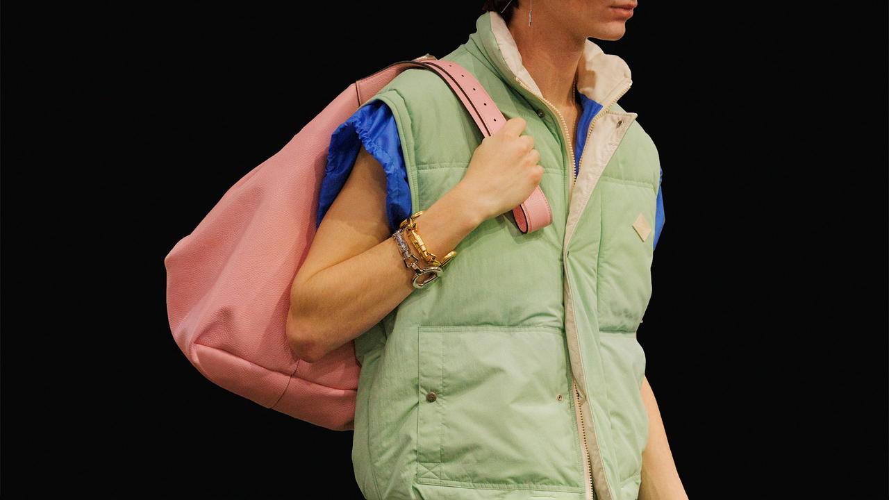 A pair of bracelets shaped in the form of Gucci's Piston Lock as seen on look 37 (Credit: Gucci)