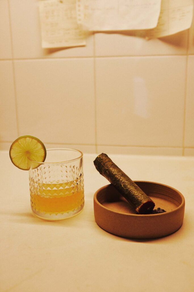 Homemade yellowtail and prawn otak-otak wrapped in wild pepper leaves with tom yum consomme