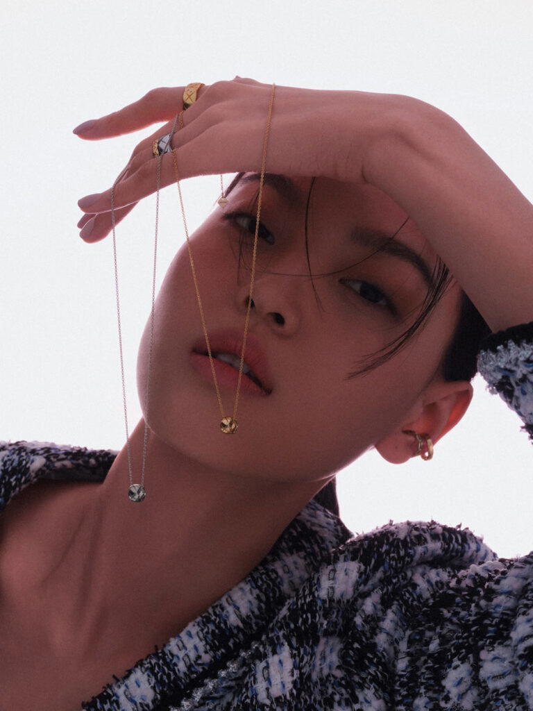 Fantasy tweed jacket, Coco Crush rings in yellow gold with diamonds, Coco Crush ring in white gold, Coco Crush necklaces in beige and white gold, and Coco Crush earrings in white and beige gold, all from Chanel