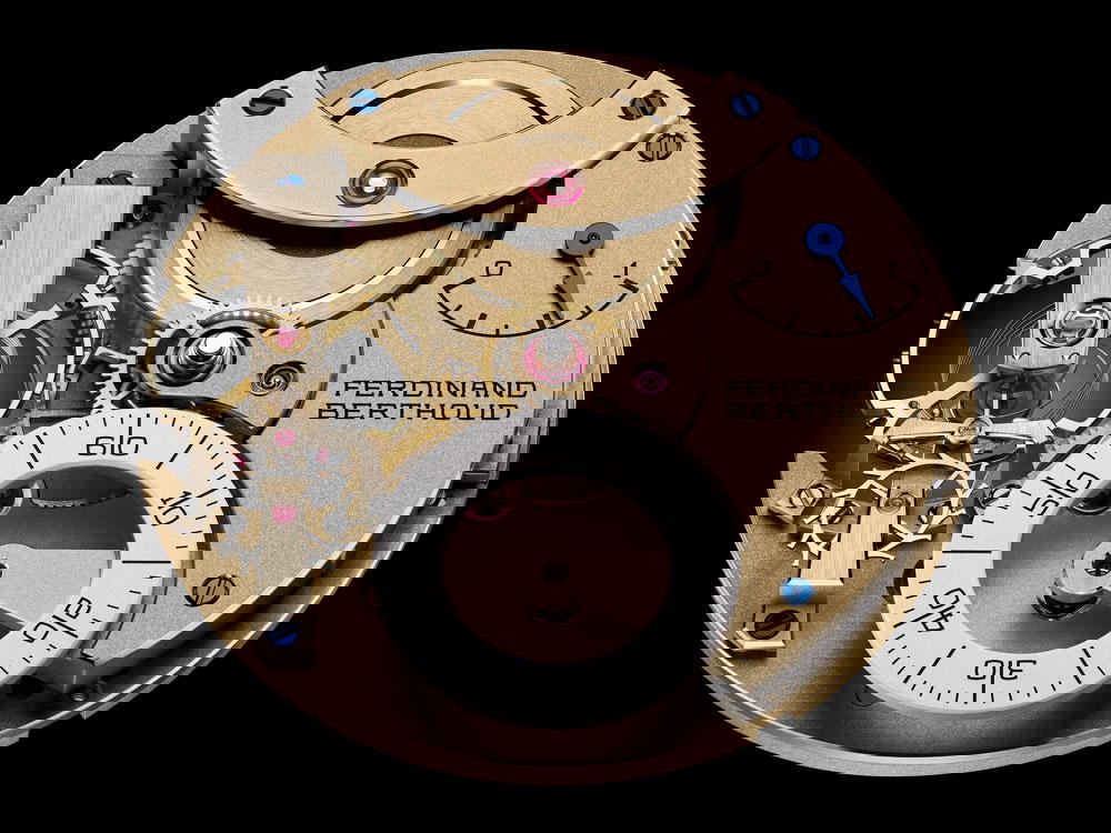 The three main escapement organs—the balance wheel, pallet lever, and escape wheel—are individually identified, distinct, and prominently displayed at 9 o'clock