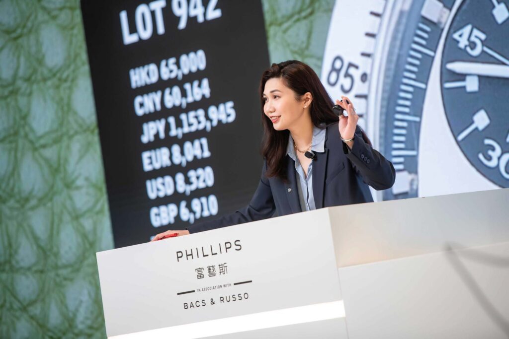 Gertrude Wong conducts an auction