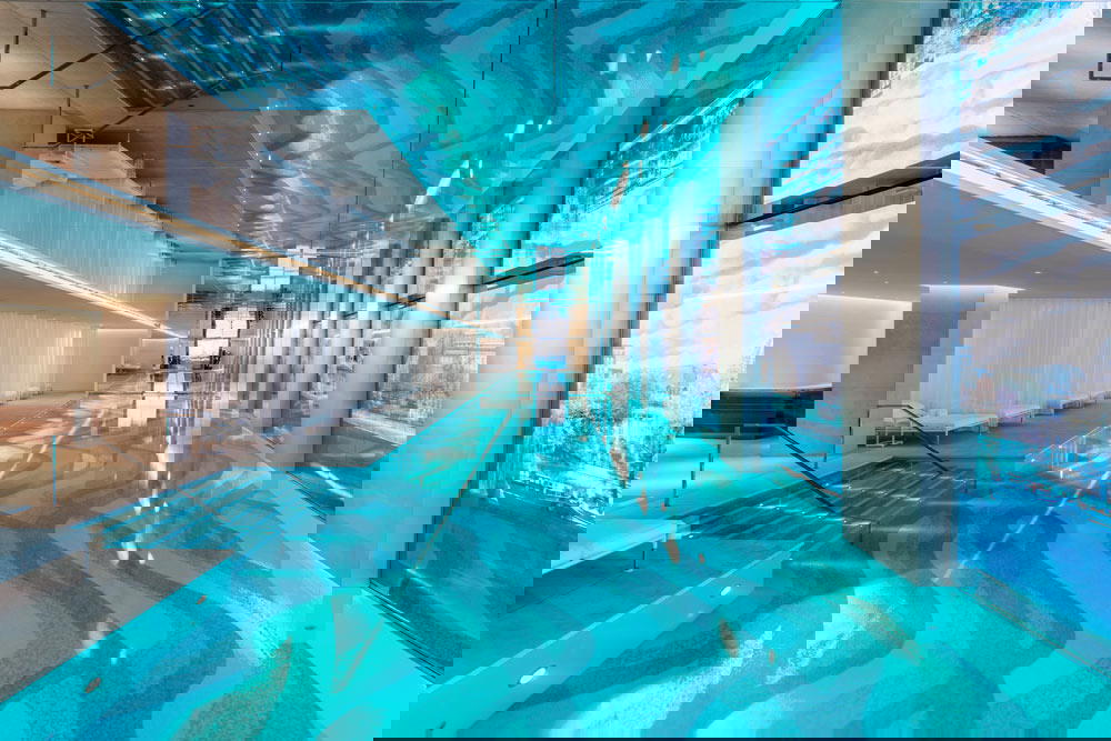 The indoor pool sits on the same level as the Seine with a digital backdrop by artist Oyoram (Credit: Alexandre Tabaste)