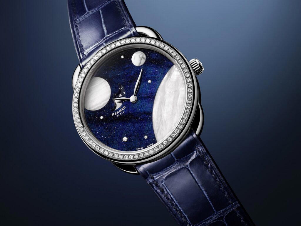 Arceau Petite Lune in white gold with aventurine, mother-of-pearl, aragonite, opal and diamonds (Credit: Hermès)