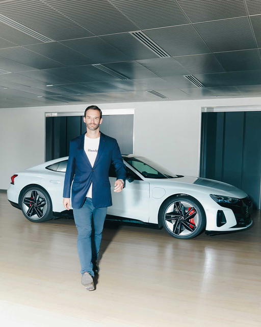 Dr Simon Schillebeeckx with the Audi RS e-tron GT (Credit: Cher Him)
