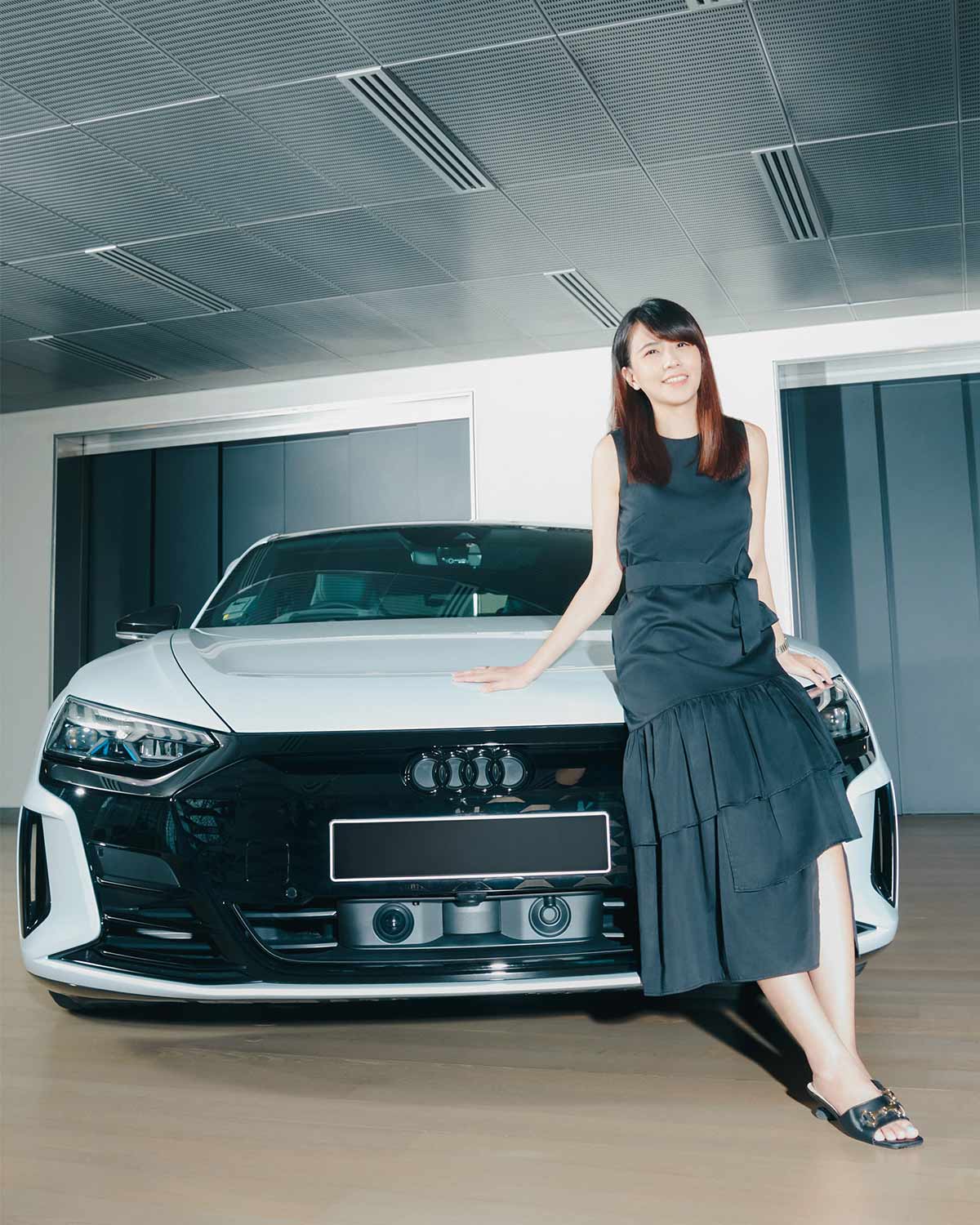 Lee Weilin with the Audi RS e-tron GT (Credit: Cher Him)