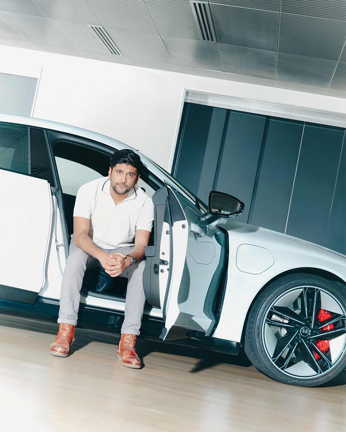 Travin Singh with the Audi RS e-tron GT (Credit: Cher Him)