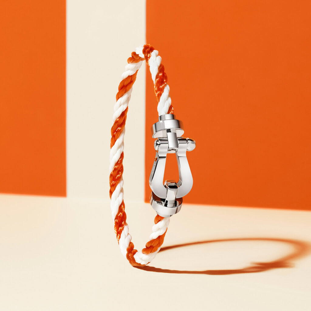 A limited series two-tone white and terracotta braided cable bracelet (Credit: Fred)