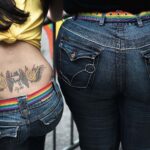 Little angel, big angel. At the NYC Pride March, this duo wore almost identical jeans and rainbow belts. A pair of angels (Credit: Lionel Leo)