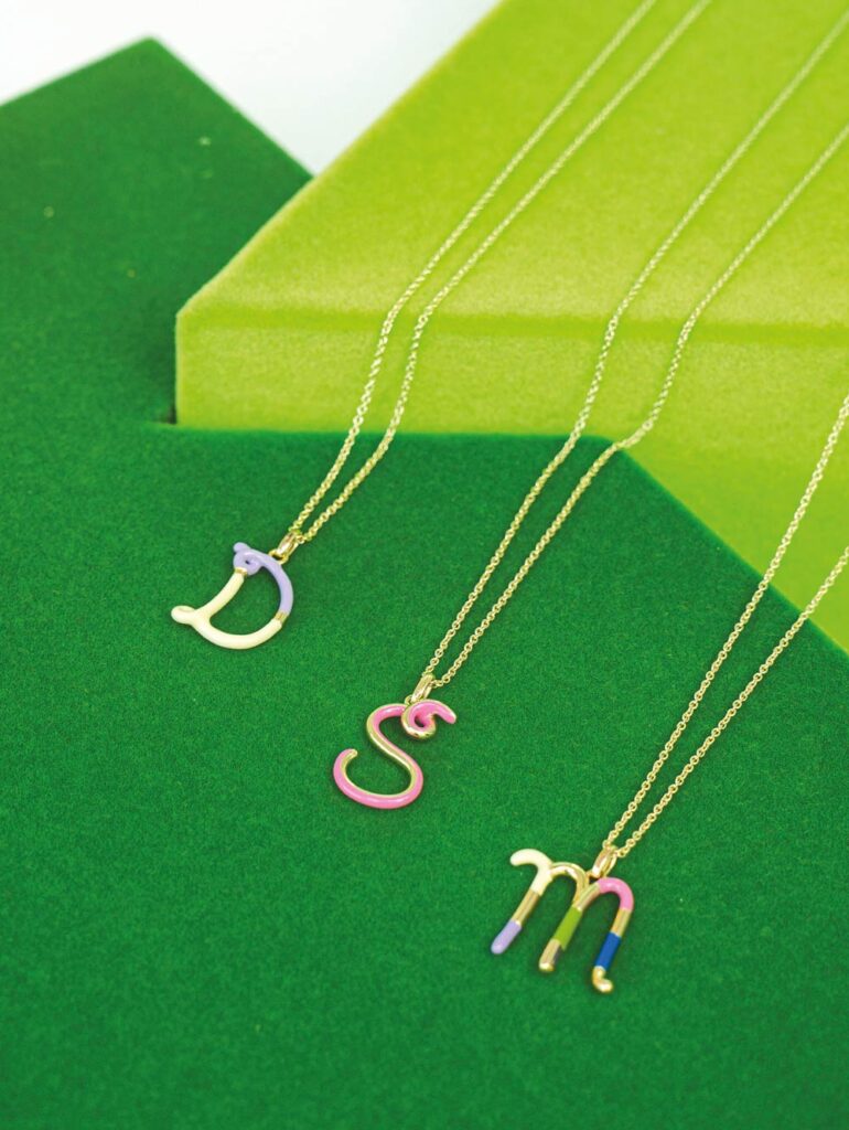 Alphabet necklaces in 9k yellow gold with enamel (Credit: Bea Bongiasca)