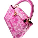 Capucines MM in fuchsia taurillon leather with Infinity Net print (Credit: Louis Vuitton)