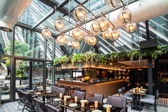 Sunlight streams in at Eden Restaurant, thanks to the glass ceiling