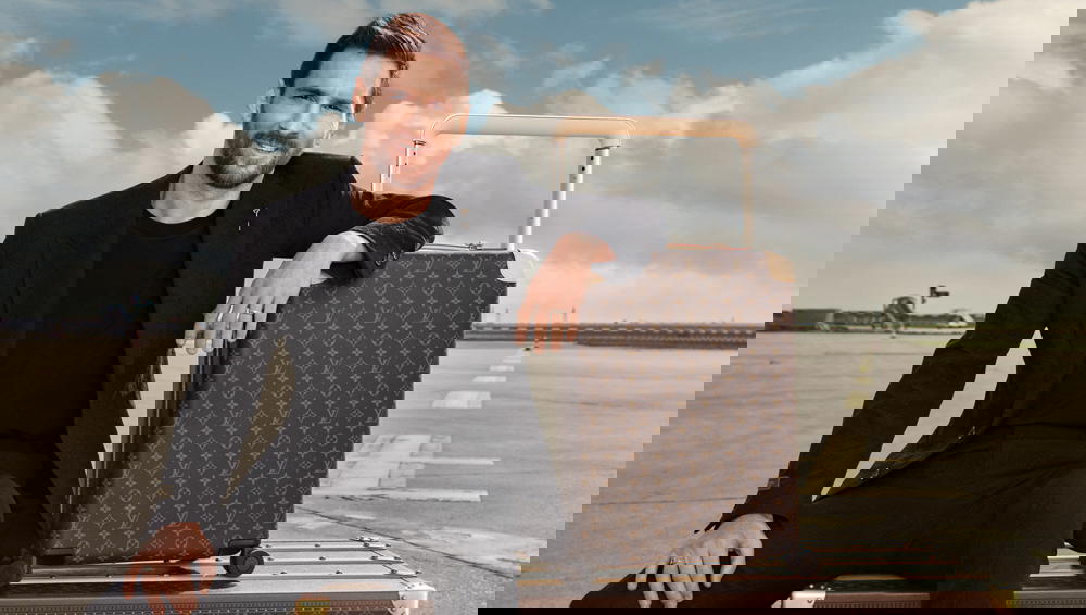 Lionel Messi with the Horizon luggage in Monogram canvas (Credit: Louis Vuitton)