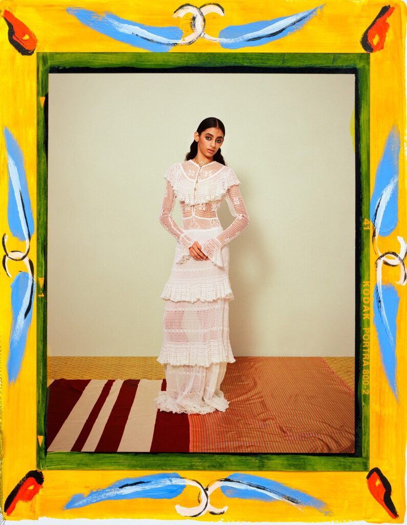 Cotton crochet dress and metal, calfskin and strass necklace, both from Chanel