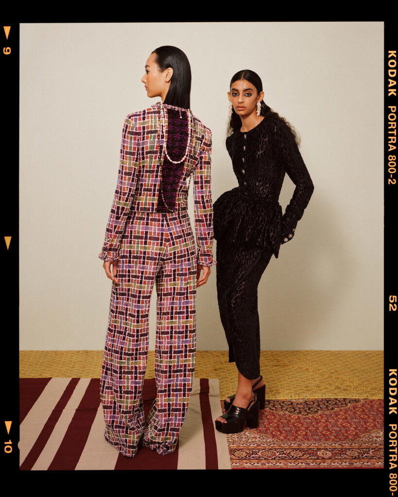 Left: Cotton tweed jacket and trousers, metal, lambskin and strass necklace, metal, glass and strass necklace, and metal, wood, glass and strass necklace. Right: Viscose jersey jacket and skirt, metal, glass and strass earrings, and patent leather sandals, all from Chanel