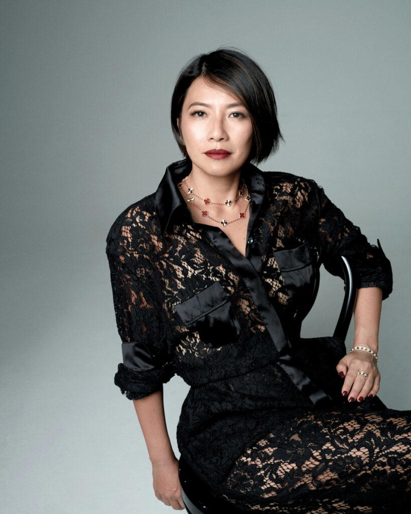 Cheah Sui Ling in a black dress on a chair