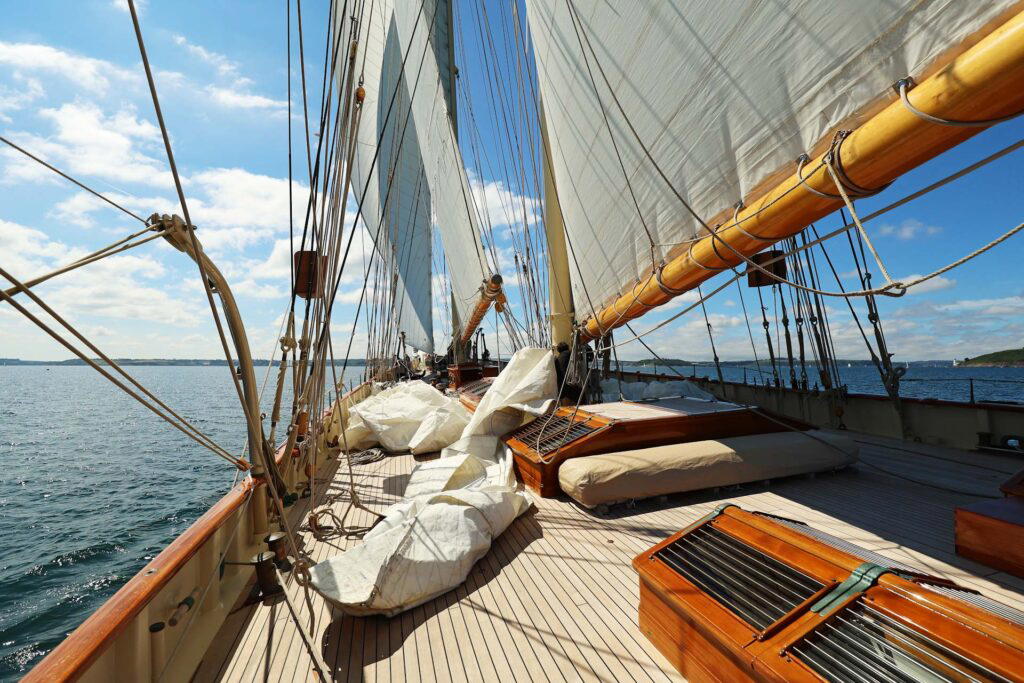 The deck of a sailboat usually is littered with ropes and sails
