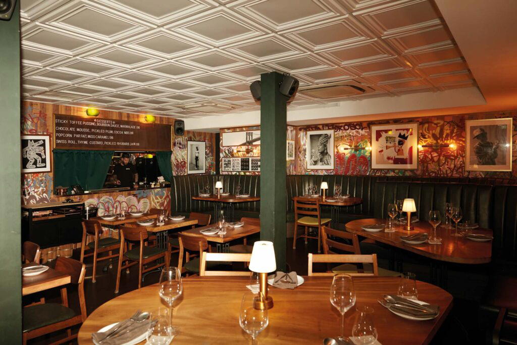 The walls are filled with pictures and paintings of New York culture