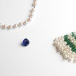 An 8.55-ct Madagascan sapphire sparkles within an elegant composition of emeralds, sapphires, diamonds and cultured pearls (Credit: Van Cleef & Arpels)
