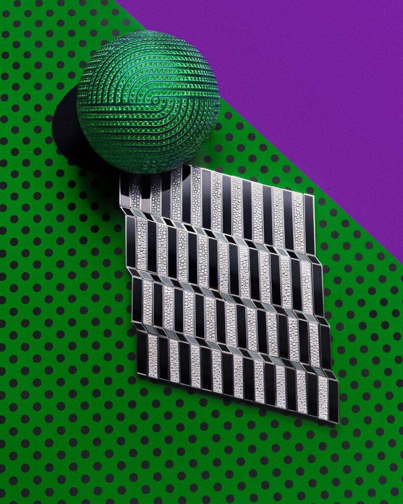 In The Pocket clothing jewel in titanium and white gold with diamonds and lacquer; An Apple A Day bracelet in titanium with tsavorites and lacquer (Credit: Boucheron)