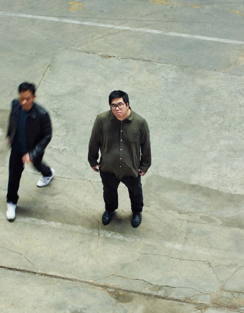 Marcus standing still while Joe walks around him