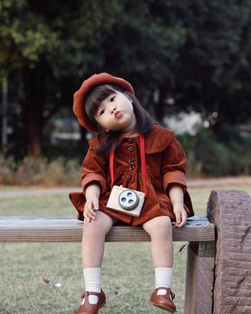 Accessorising with the Plantoys wooden coloured snap camera