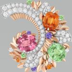 Symphonie florale clip in white and rose gold, with garnets, sapphires and diamonds (Credit: Van Cleef & Arpels)