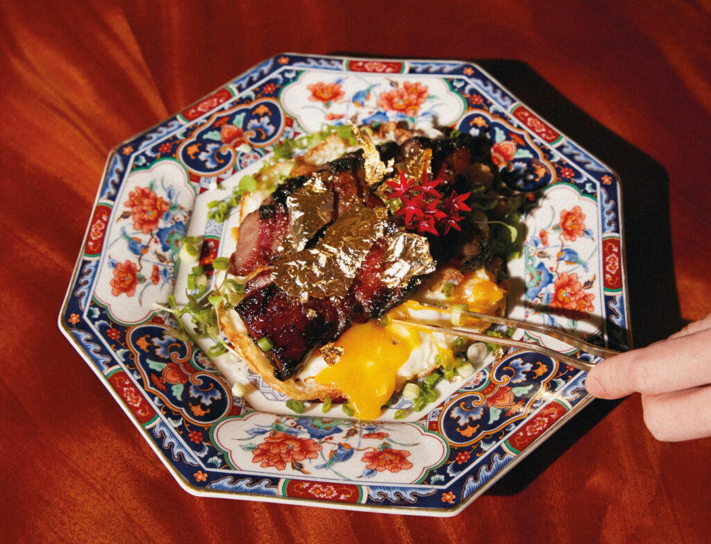 Iberico pork char siu, crispy eggs, and gold flakes