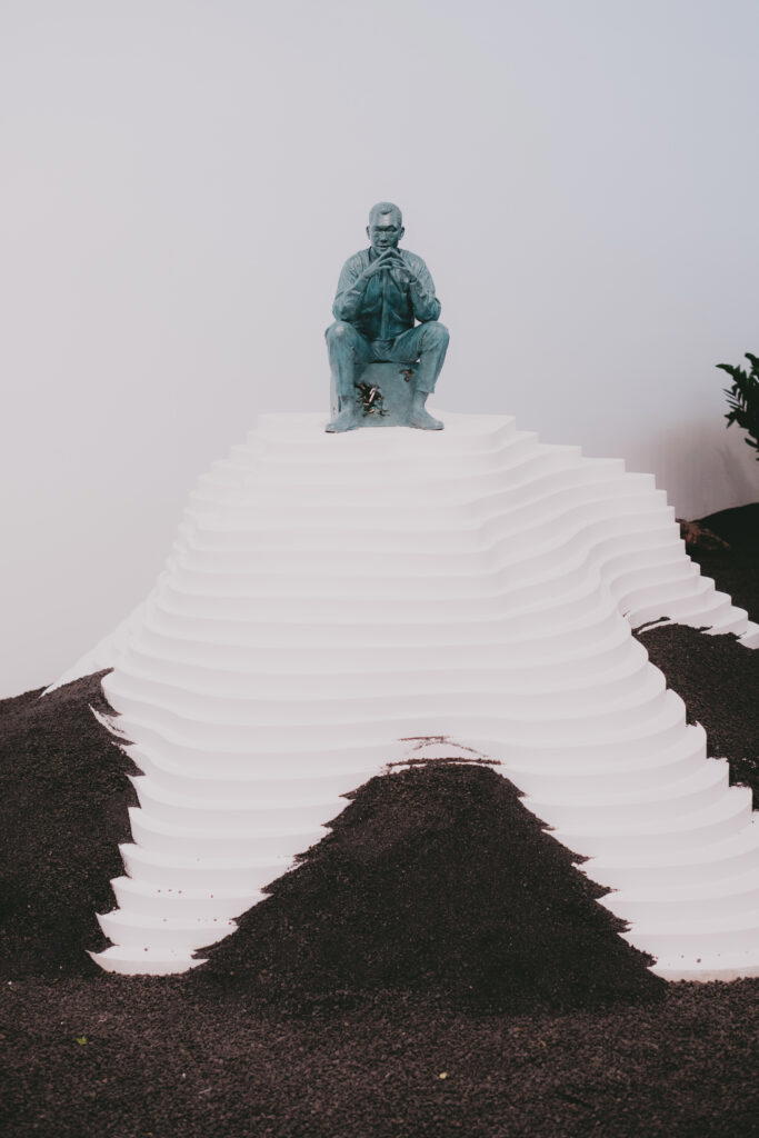 A full-body sculpture of Mr Lee in a pivotal moment in history