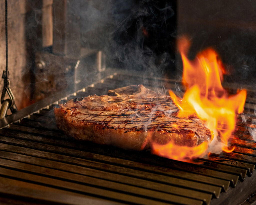 The custom-built parrilla grill that Chef Angelo Sergio uses to cook the steaks