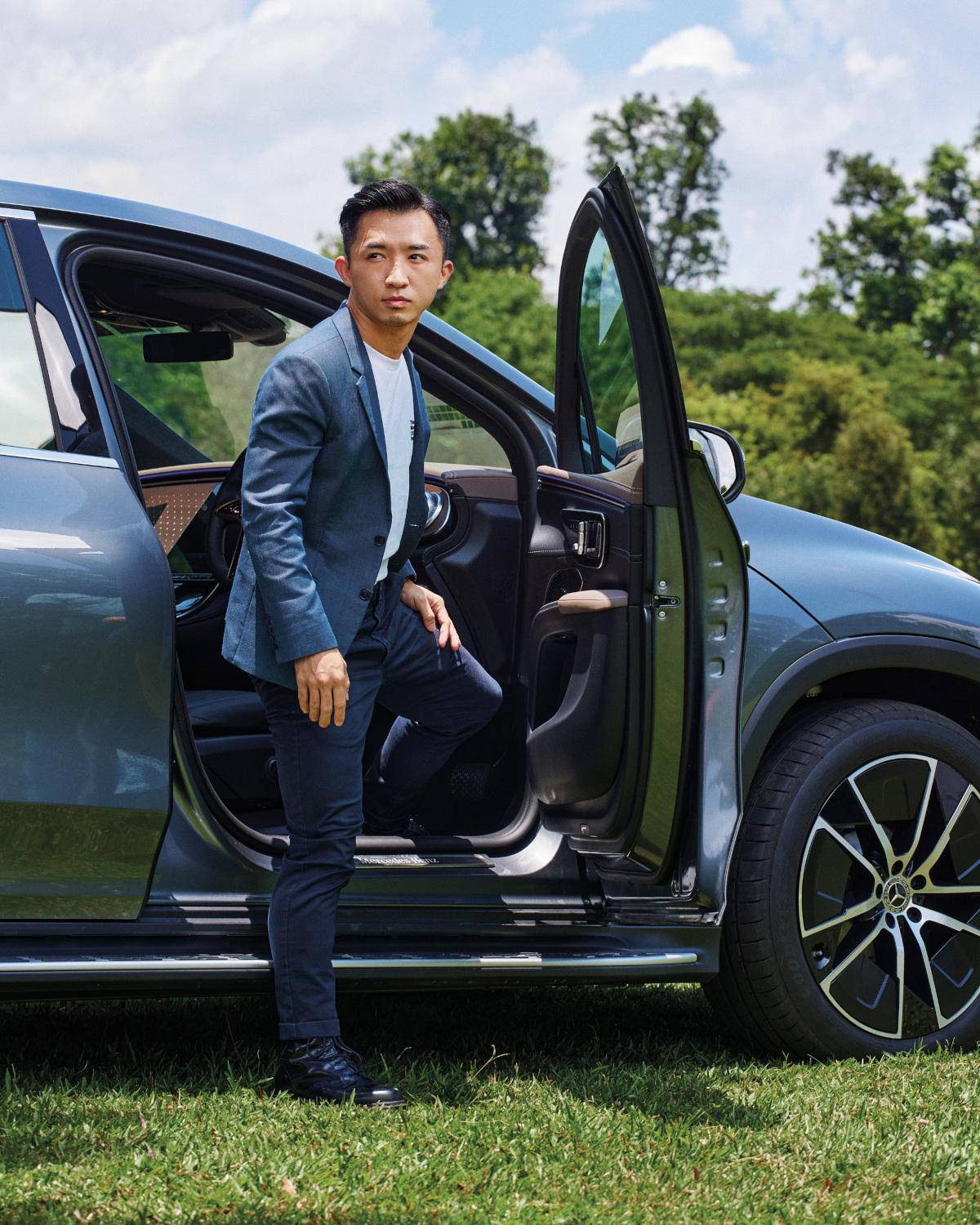 Bolong Chew with the Mercedes Benz EQS SUV. He founded Solar AI with the aim of making solar simple (Credit: Mun Kong. )