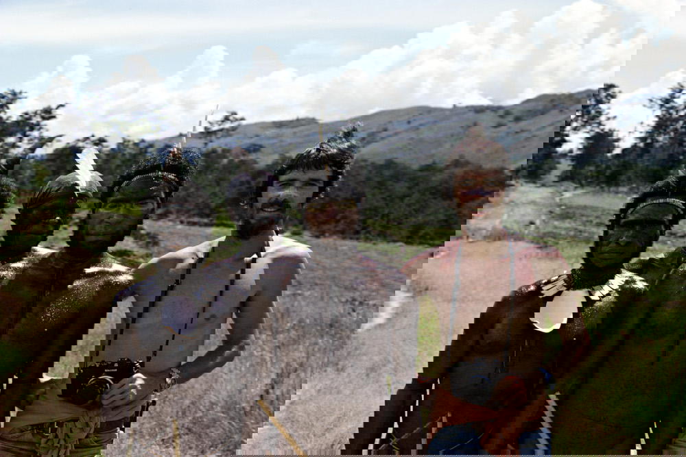 Hannes Schmid and the cannibals of Indonesian highlands in 1975 (Credit: Hannes Schmid)