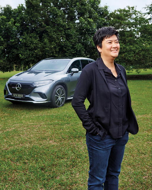 Pamela Chng with the Mercedes Benz EQS SUV. Bettr Group currently conducts two core social programmes (Credit: Mun Kong. )