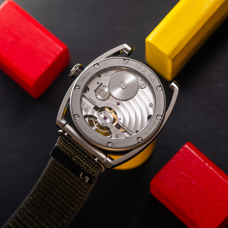 Caseback of the Le Régulateur Tourbillon Louis Erard x Alain Silberstein Khaki featuring the movement visible through the transparent caseback, as well as the engraved inscription “Louis Erard x AS 1 of 178” (Credit: Louis Erard)