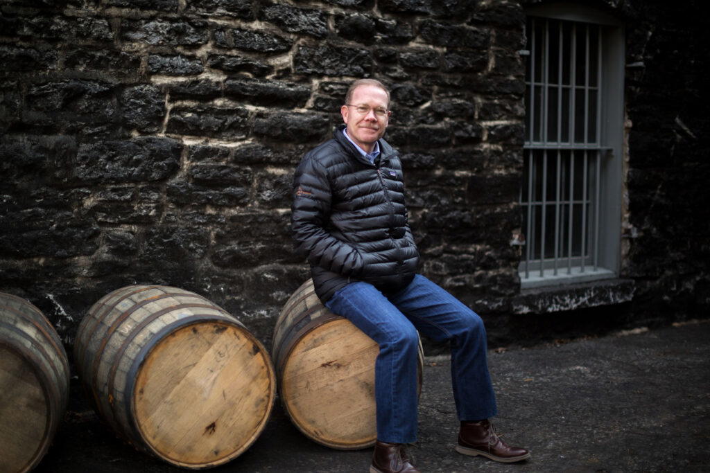 Chris Morris sits on barrels