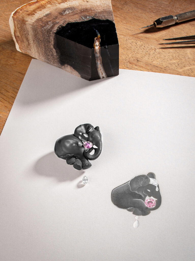 Elephant Noir High Jewellery brooch in white gold with petrified magnolia, peanut wood, a pink sapphire, and diamonds