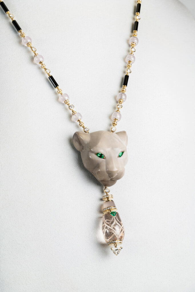 Hypnotic Panthère in yellow gold with calamite, morganites, chalcedonies, emeralds, onyx, and diamonds