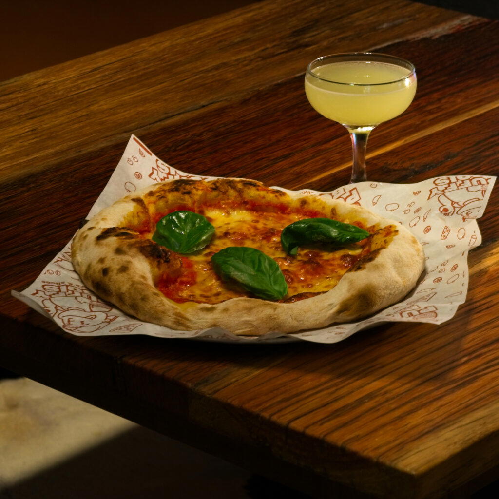 The classic margherita pizza pairs well with the ‘what what’ cocktail