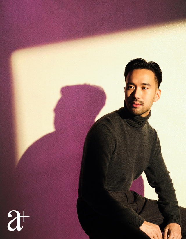 Goh is wearing a cashmere turtleneck sweater and wool trousers, both from Ralph Lauren Collection