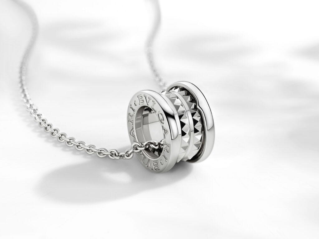 Inspired by Bulgari’s B.zero1 Rock line, the sterling silver pendant necklace showcases a round pendant with edgy metallic studs (Credit: Bulgari)