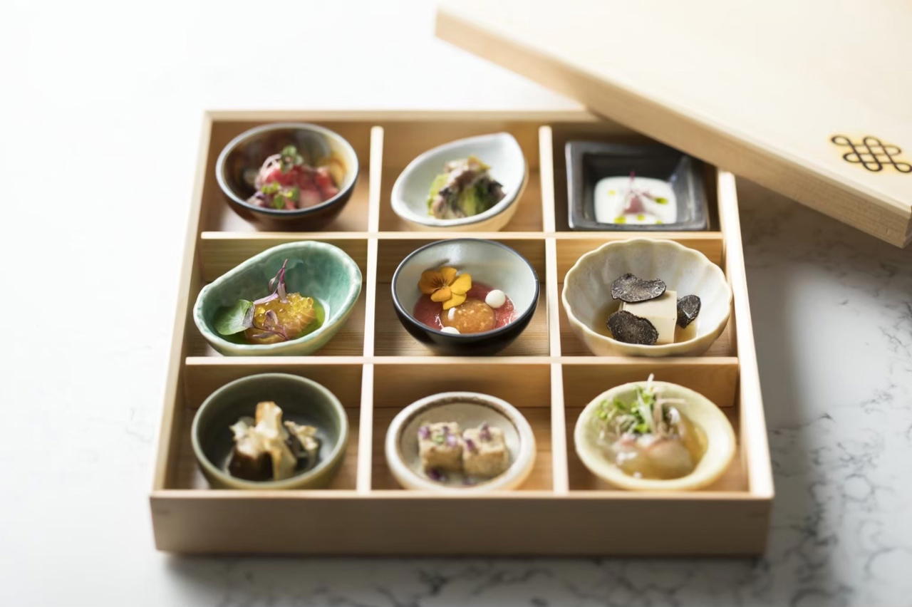 The Shokado-9 comes in a wooden bento box that opens to reveal nine bite-sized, seasonal amuse-bouches