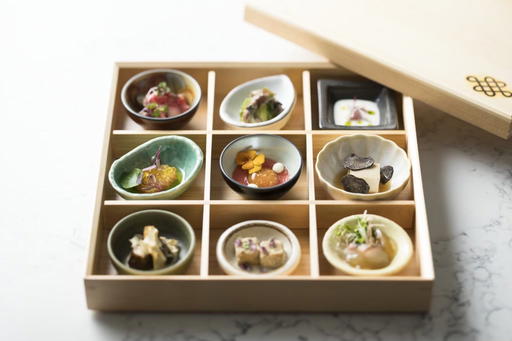 The Shokado-9 comes in a wooden bento box that opens to reveal nine bite-sized, seasonal amuse-bouches