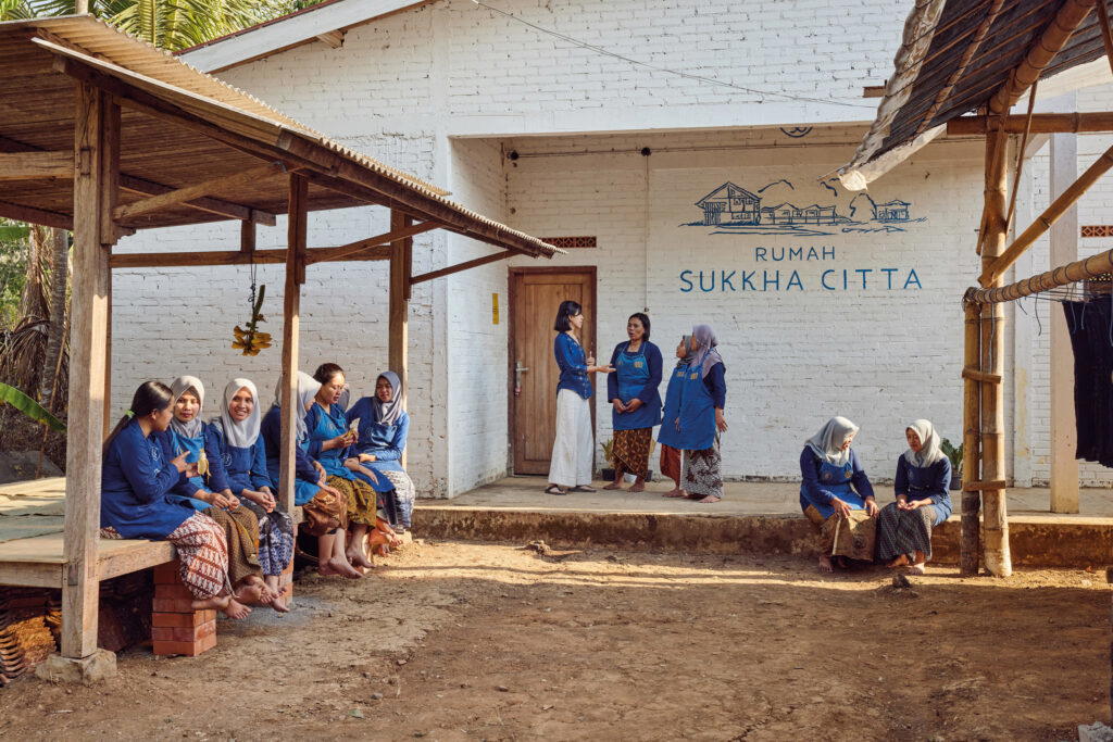2023 Rolex Awards for Enterprise Laureate Denica Riadini-Flesch talking to women at one of SukkhaCitta’s craft schools. Riadini-Flesch is passionate about empowering women in rural Indonesia by giving them access to education and equipping them with the skills they need to earn a living wage